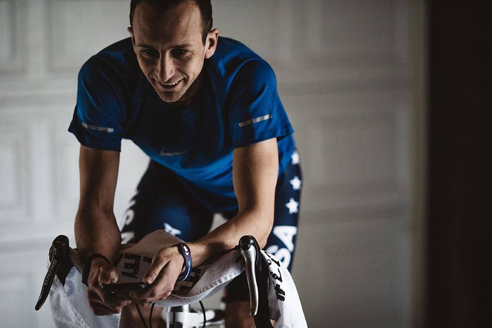 Aaron Schedies training on a bicycle.