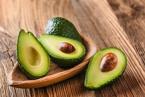 Avocados sliced on a table.