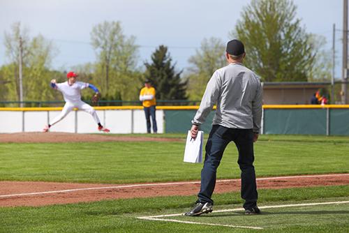 Baseball coach on third base.