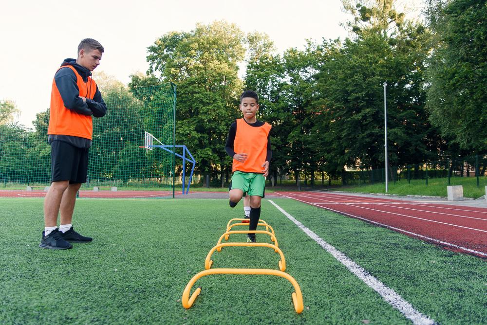 Young male soccer player training.