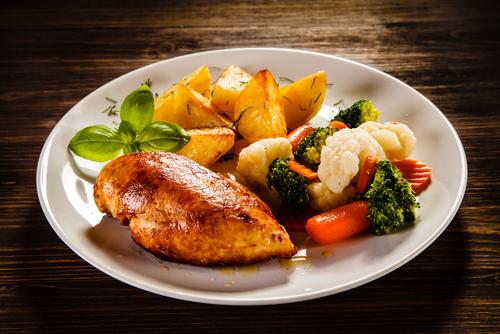 Grilled chicken, roasted potatoes and vegetables.