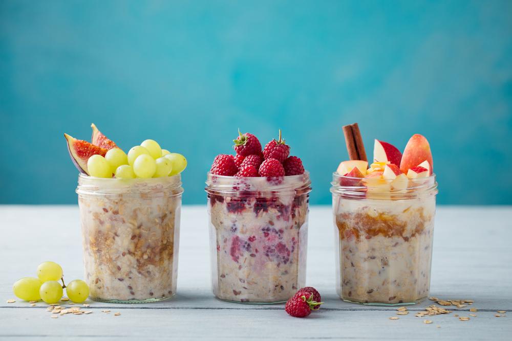 Three jars of overnights oats with different fruit.