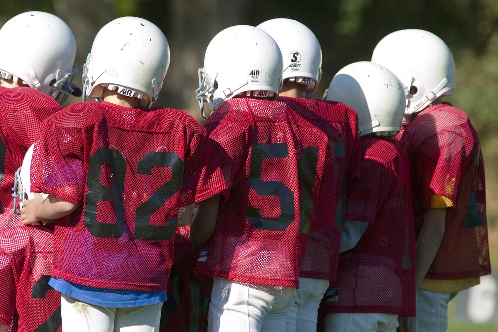 Young football team from behind.