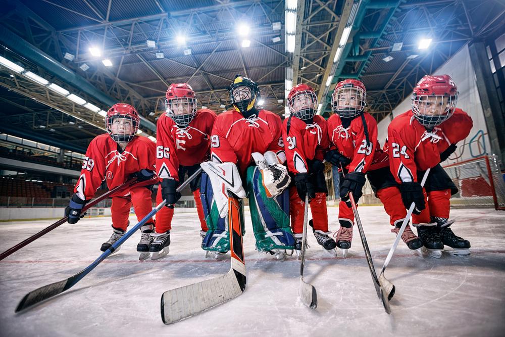 Young hockey team on the ice together.