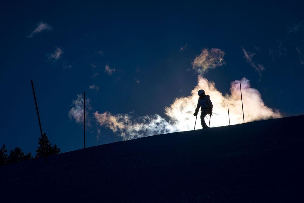 Disabled skiier at top of a hill.