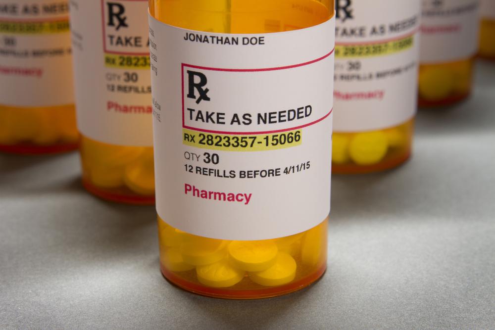 Generic prescription medication bottles.