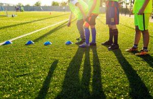 young soccer athletes starting a training session.