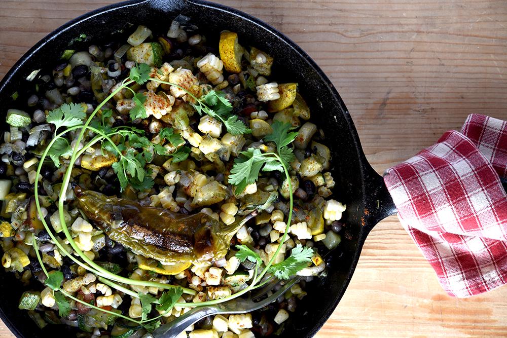 Succotash in a cast iron pan.