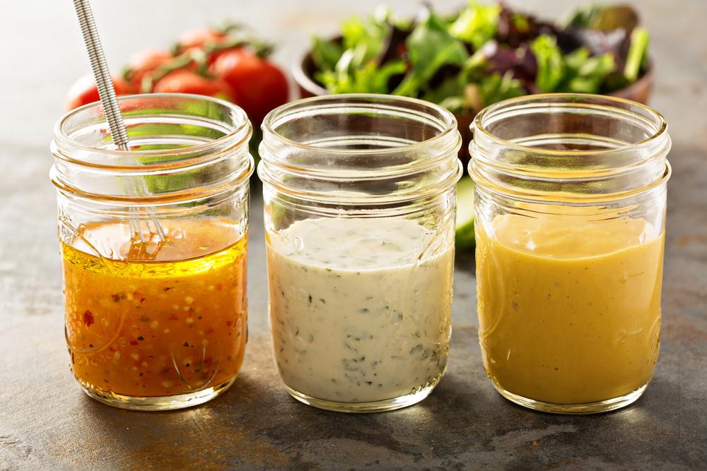 Jars of different kinds of salad dressing.